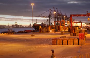 Cranes and containers in shipyard